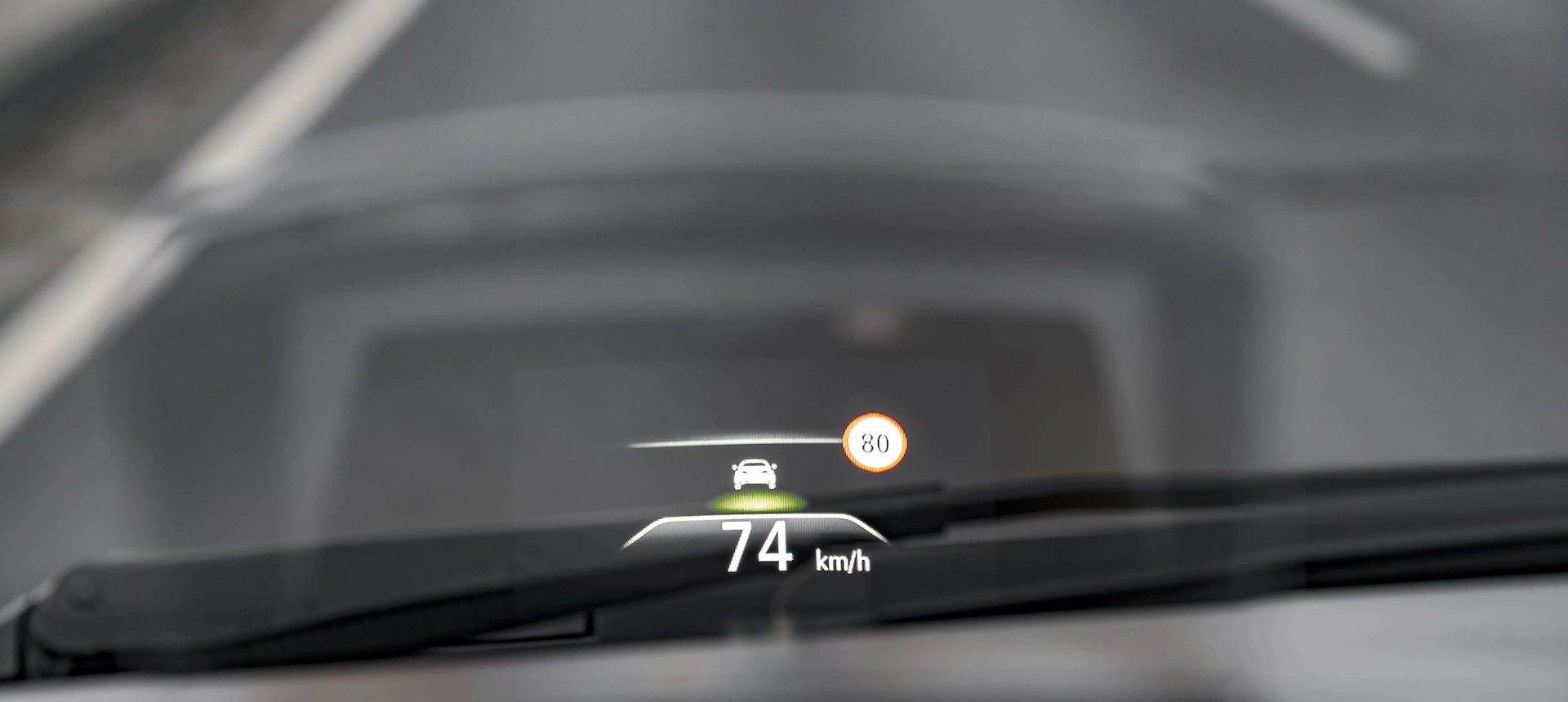 A head-up display device that reflects driving info at the driver's eye level.